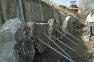 Limestone rocks being supported before concreting in place